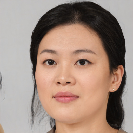Neutral asian young-adult female with medium  black hair and brown eyes