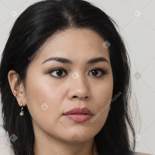 Joyful asian young-adult female with long  brown hair and brown eyes