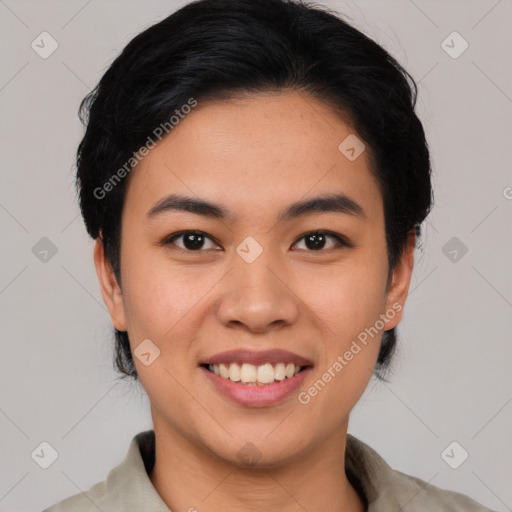 Joyful asian young-adult female with short  black hair and brown eyes