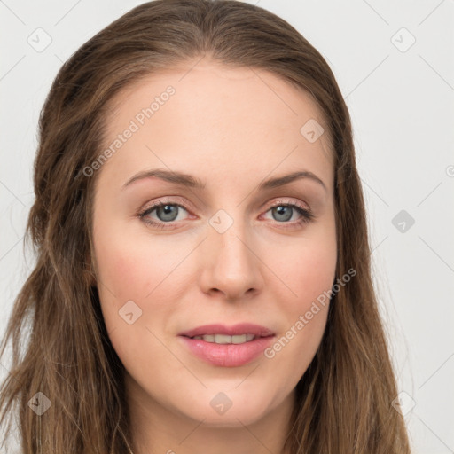 Joyful white young-adult female with long  brown hair and green eyes