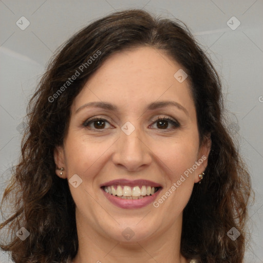 Joyful white adult female with long  brown hair and brown eyes