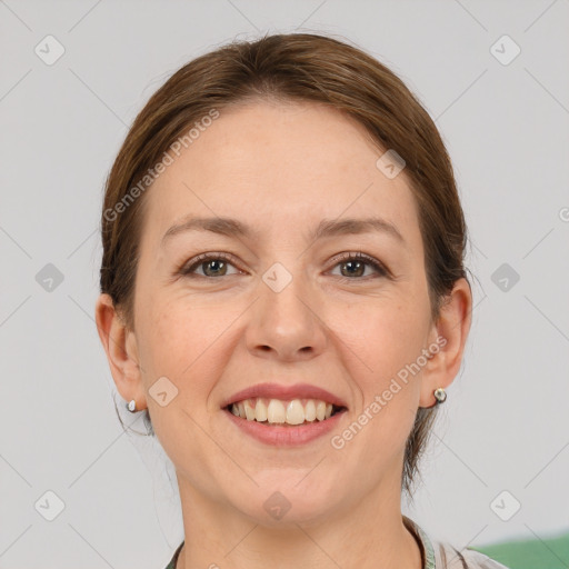 Joyful white adult female with medium  brown hair and grey eyes