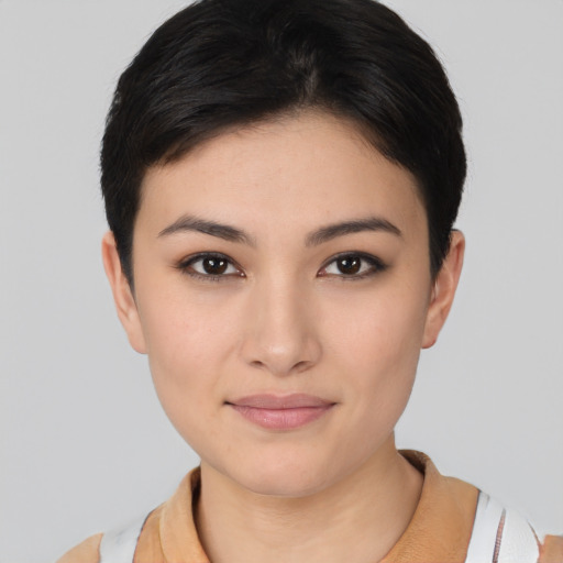 Joyful asian young-adult female with short  brown hair and brown eyes