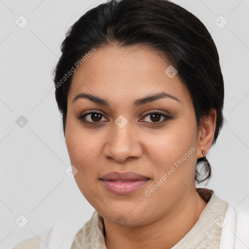 Joyful latino young-adult female with medium  brown hair and brown eyes