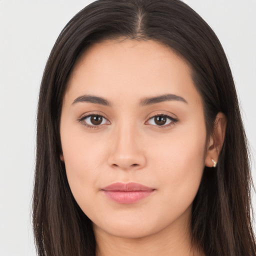 Joyful asian young-adult female with long  brown hair and brown eyes