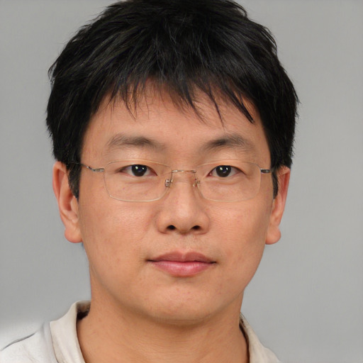 Neutral asian young-adult male with short  brown hair and brown eyes