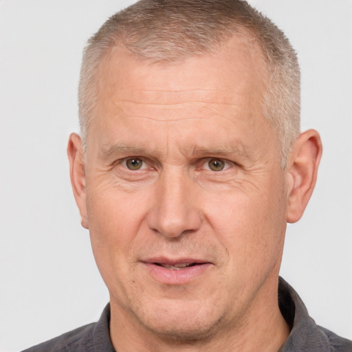 Joyful white middle-aged male with short  brown hair and brown eyes