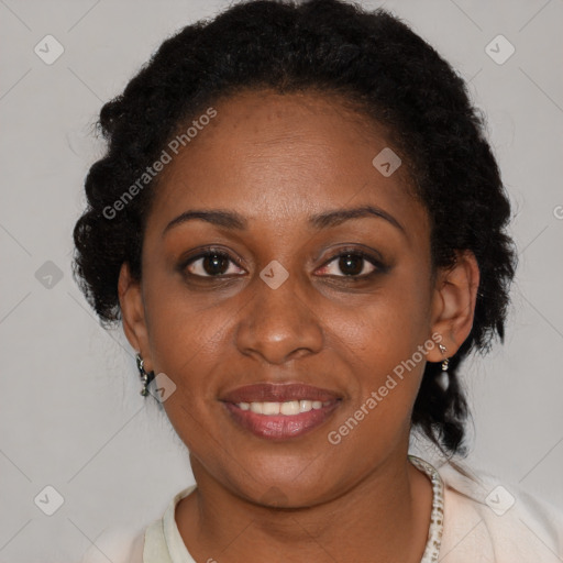 Joyful black adult female with short  brown hair and brown eyes