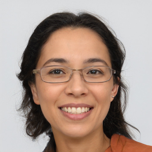 Joyful white adult female with medium  brown hair and brown eyes