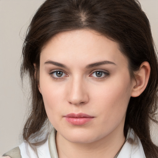 Neutral white young-adult female with medium  brown hair and brown eyes