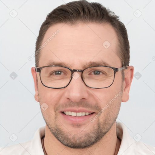 Joyful white adult male with short  brown hair and brown eyes