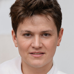 Joyful white young-adult male with short  brown hair and brown eyes