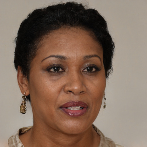 Joyful black adult female with short  brown hair and brown eyes