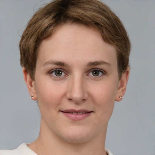 Joyful white young-adult female with short  brown hair and grey eyes