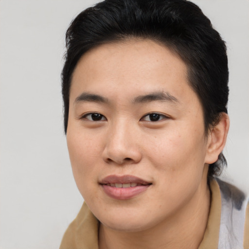 Joyful asian young-adult female with medium  brown hair and brown eyes
