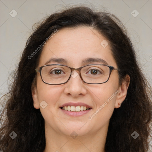 Joyful white adult female with long  brown hair and brown eyes