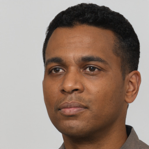 Neutral black young-adult male with short  black hair and brown eyes