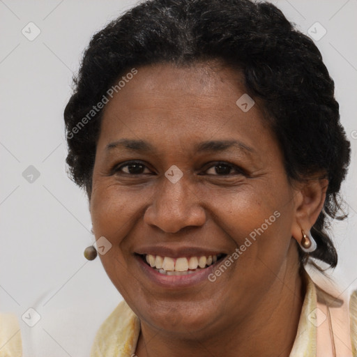 Joyful black adult female with short  brown hair and brown eyes