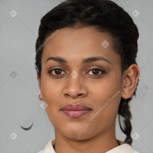 Joyful black young-adult female with short  brown hair and brown eyes