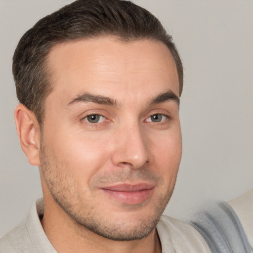 Joyful white young-adult male with short  brown hair and brown eyes