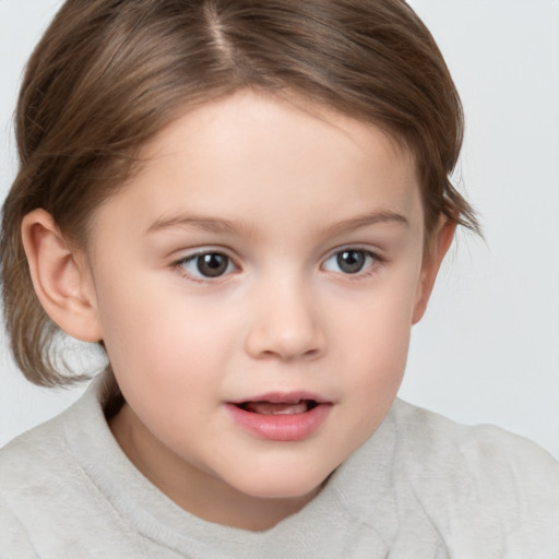 Joyful white child female with short  brown hair and brown eyes