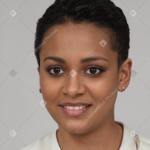 Joyful black young-adult female with short  black hair and brown eyes