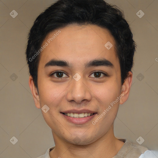 Joyful latino young-adult male with short  black hair and brown eyes