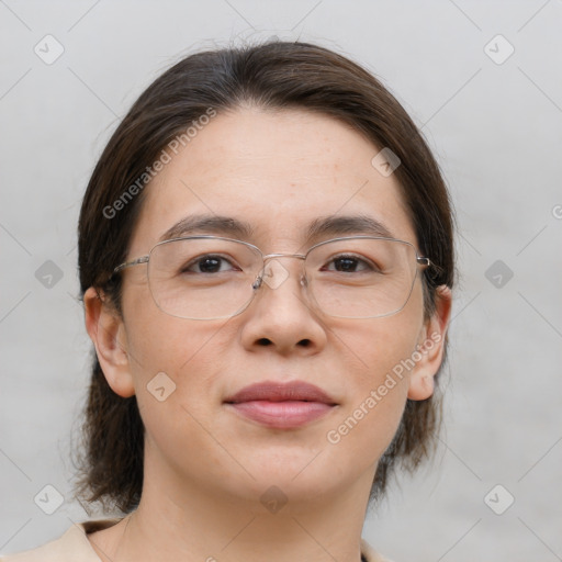 Joyful white adult female with medium  brown hair and brown eyes