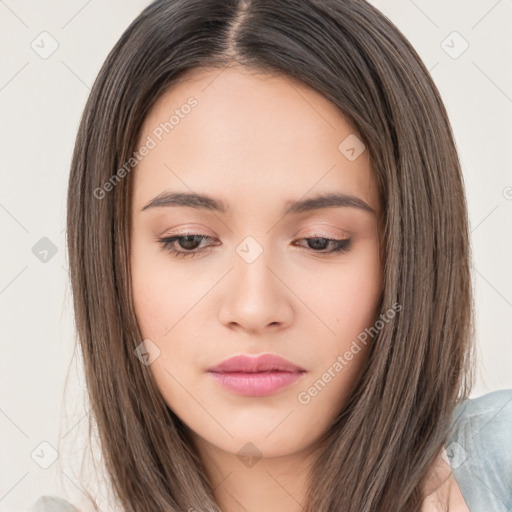 Neutral white young-adult female with long  brown hair and brown eyes