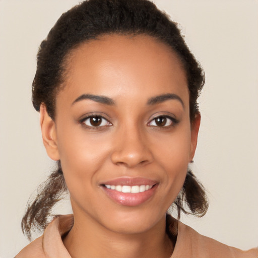 Joyful latino young-adult female with short  brown hair and brown eyes