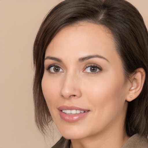 Joyful white young-adult female with medium  brown hair and brown eyes