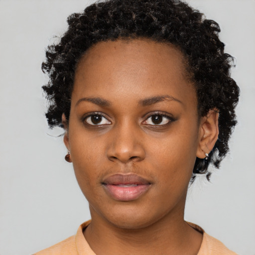 Neutral black young-adult female with short  brown hair and brown eyes