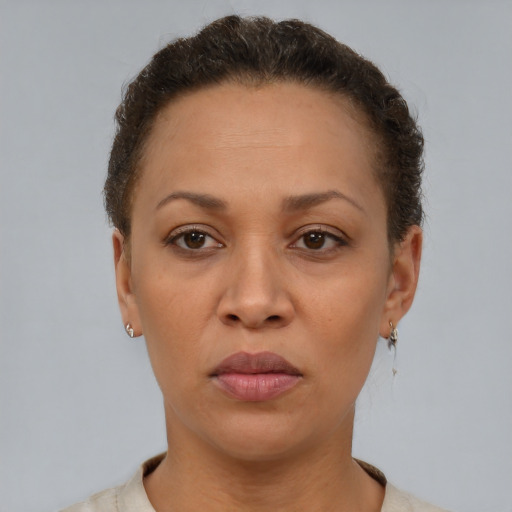 Neutral latino adult female with short  brown hair and brown eyes