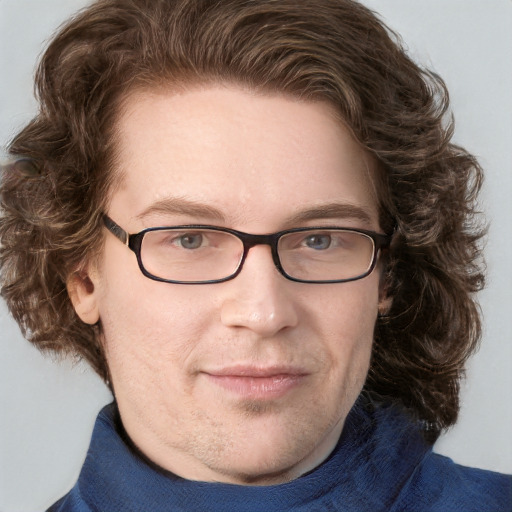 Joyful white adult male with medium  brown hair and blue eyes