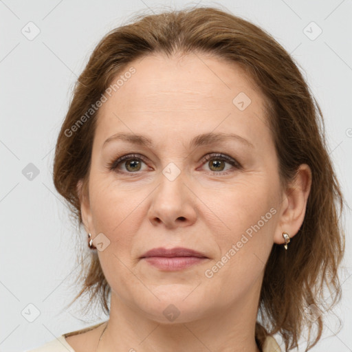 Joyful white adult female with medium  brown hair and brown eyes