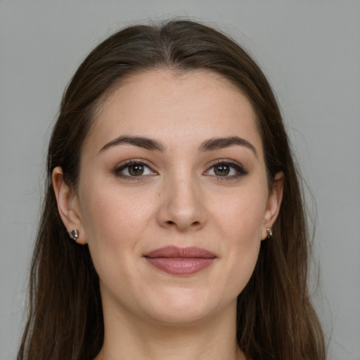 Joyful white young-adult female with long  brown hair and grey eyes