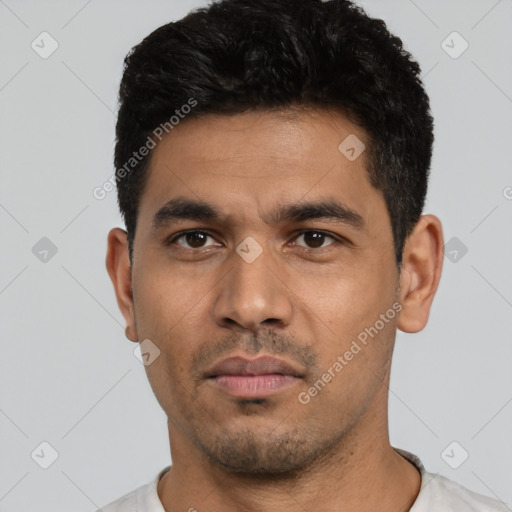Neutral white young-adult male with short  black hair and brown eyes