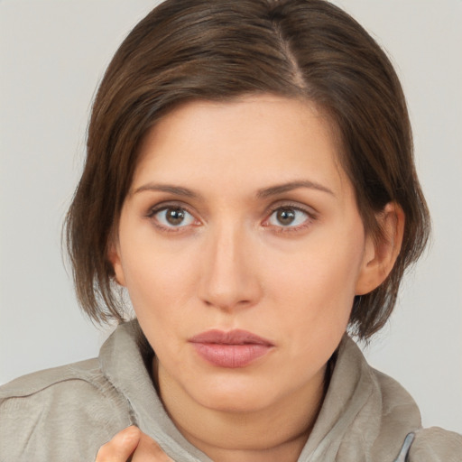 Neutral white young-adult female with medium  brown hair and brown eyes