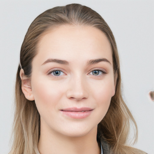 Joyful white young-adult female with long  brown hair and grey eyes