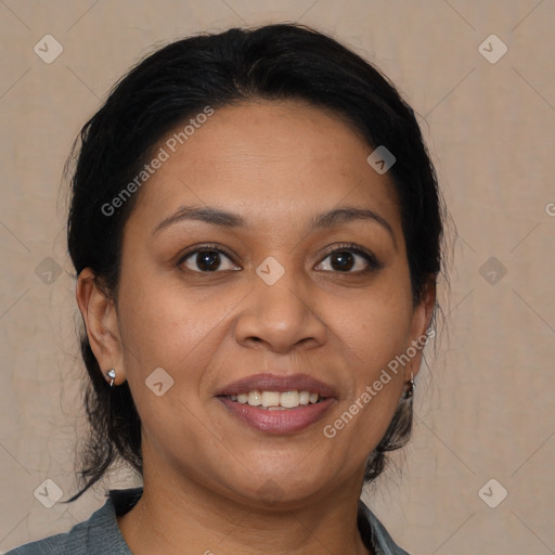 Joyful latino adult female with medium  brown hair and brown eyes