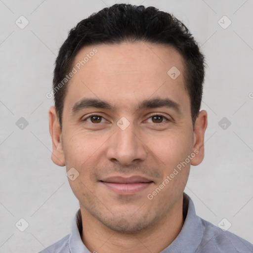 Joyful white young-adult male with short  black hair and brown eyes