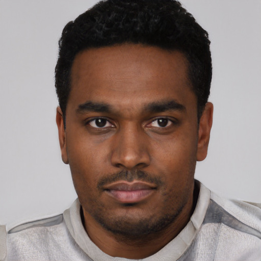 Neutral black young-adult male with short  black hair and brown eyes