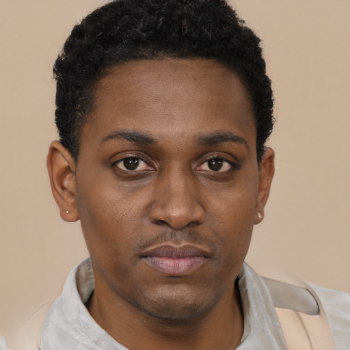Neutral black young-adult male with short  black hair and brown eyes