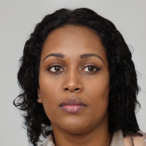 Neutral black young-adult female with long  black hair and brown eyes
