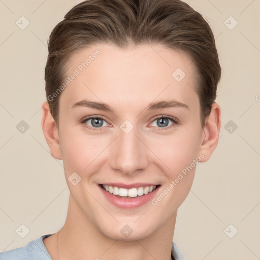 Joyful white young-adult female with short  brown hair and grey eyes