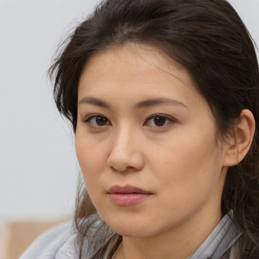 Neutral asian young-adult female with medium  brown hair and brown eyes