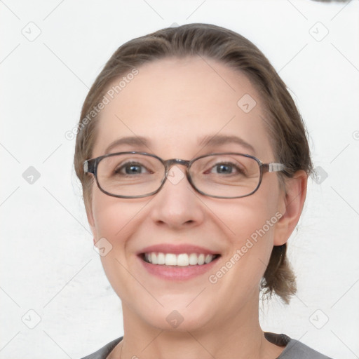 Joyful white young-adult female with medium  brown hair and blue eyes