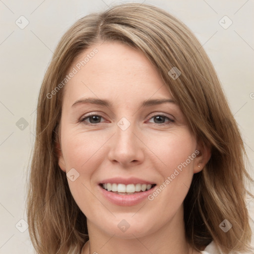 Joyful white young-adult female with long  brown hair and grey eyes