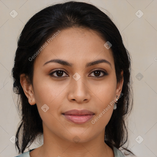 Joyful latino young-adult female with medium  brown hair and brown eyes