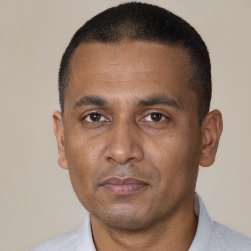 Neutral black adult male with short  black hair and brown eyes